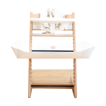 The Catchy Food Catcher for High Chairs attached to a wooden high chair.
