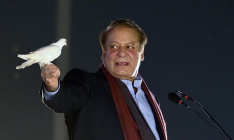 Nawaz Sharif holding a dove in one hand.