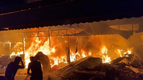 Gaza: tents engulfed by flames next to al-Aqsa hospital after Israeli airstrike – video