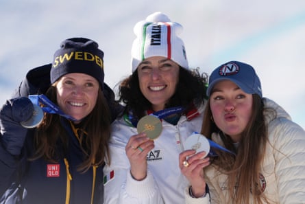 Federica Brignone poses with her gold medal between Federica Brignone and Thea Louise Stjernesund, who both won silver.
