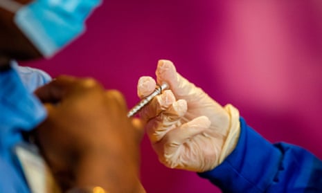 Healthcare workers received their first shot from at the Hartford Convention Center in Hartford, Connecticut on 4 January.