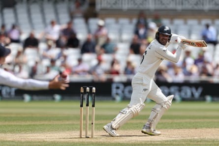 Tom Blundell plays a shot just past the hand of England fielder Jacob Bethell at Trent Bridge.