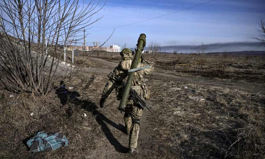 A Ukrainian serviceman walks towards the front line in Irpin, northern Ukraine