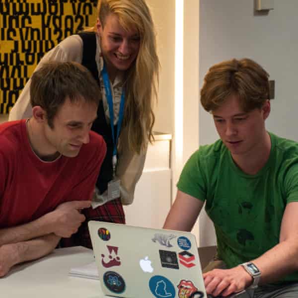 Guardian Developers attempting to browse websites without using a mouse. One person is filling in a survey on a laptop, while two other people watch