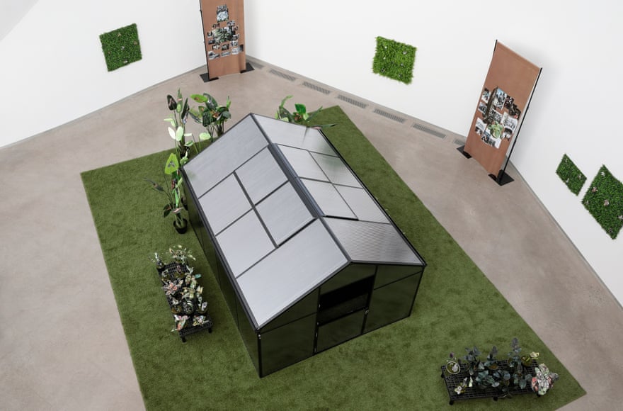 Kandis Williams’s A Field: a shed stands on a rug of artificial turf
