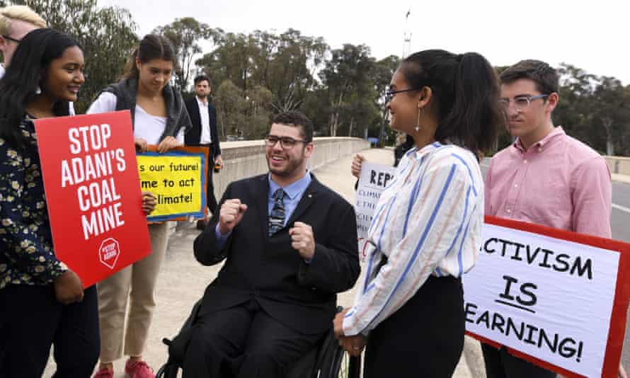Young protesters speak to Australian Greens senator Jordan Steele-John.