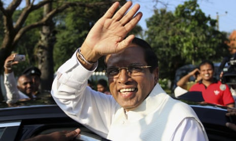 Sri Lanka’s president-elect Maithripala Sirisena gestures as he leaves after casting his vote during the presidential elections at a polling station in Polonnaruwa, about 200 kilometers (124 miles) northeast of Colombo, Sri Lanka.