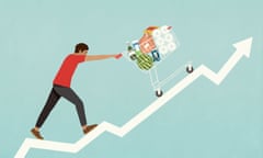 Man pushing shopping cart of groceries up line chart arrow<br>GettyImages-1396817205