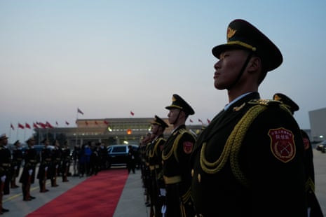 A Chinese honour guard preparing for the arrival of Keir Starmer at an airport in Beijing.