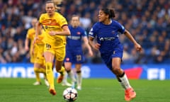 Chelsea’s Jess Carter runs with the ball under pressure from Fridolina Rolfö of Barcelona during the Women's Champions League semi-final second leg.