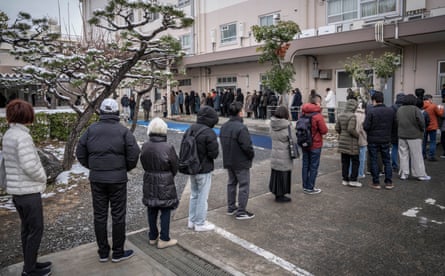 People queue at a polling station in Kawasaki, Kanagawa Prefecture
