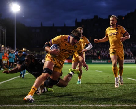 Tom Lockett muscles his way in to score Northampton’s third try.