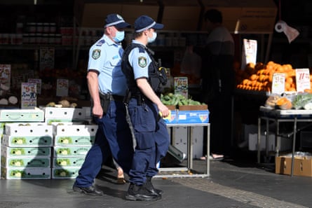 Police patrol the streets of Bankstown in south-west of Sydney to impose restrictions to stop the spread of the Delta variant of the coronavirus.