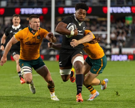 Peter Lakai breaks a tackle on the way to scoring a try for the All Blacks in their Bledisloe Cup Test victory against the Wallabies at Eden Park in Auckland