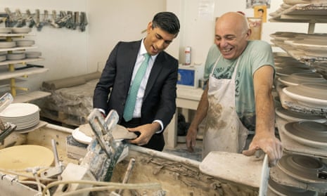 Chancellor of the exchequer Rishi Sunak handling clay while visiting the Emma Bridgewater pottery in Stoke-on-Trent.