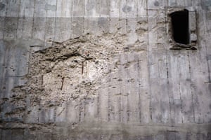 Signs of mortar shelling on a wall of the former Reichsbahnbunker