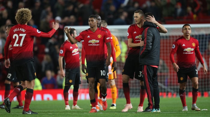 The United players walk off at the end of the match.