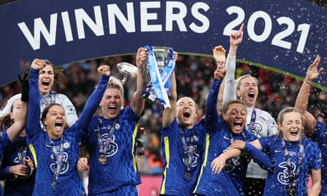 Chelsea lift the Women’s FA Cup trophy following their 3-0 win against Arsenal.