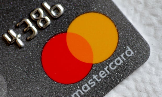 A Mastercard logo is seen on a credit card 