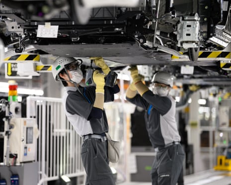 Workers at a Nissan plant in Japan