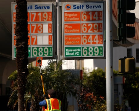 A worker changes the prices for gas at a 76 station on March 11, 2026 in Beverly Hills, California.
