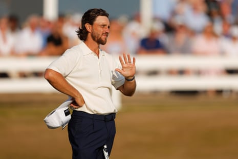 Tommy Fleetwood of England reacts on the 18th green