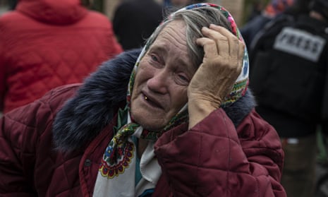A woman cries as residents work to heal their wounds in Balakliya after Russian forces withdrew as the Russia-Ukraine war continues.
