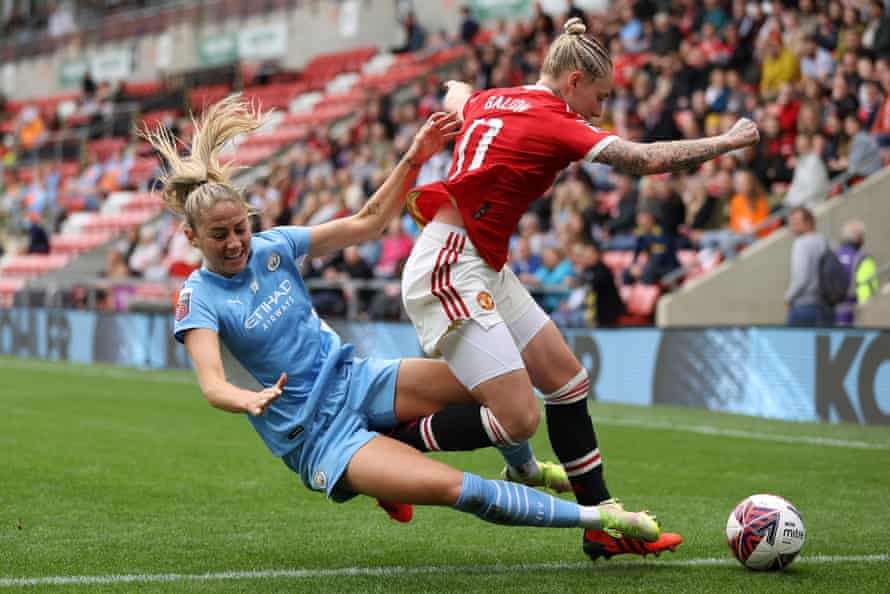 Janine Beckie slides in to tackle Leah Galton during last month’s WSL Manchester derby.