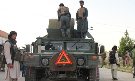 Soldiers on military vehicle