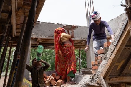 Satyam Kumar, 5, the son of Inder Kumar and Laxmi, drinks water at a construction site in Sector 92, Gurgaon. He doesn’t go to school and stays at the site while his parents work as labourers.