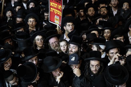 Men and boys gather at a mass ultra-Orthodox Jewish rally against military conscription.
