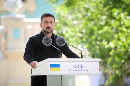 Volodymyr Zelenskyy speaking at a podium