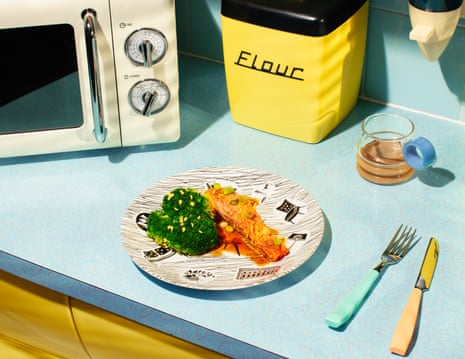 A retro-looking image of a counter top with a plate of salmon and broccoli, next to a microwave and period kitchen equipment