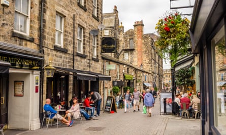 a cobbled street with restaurants and shops in Harrogate