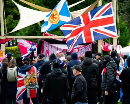 Union and saltire flags flying at the Pink Ladies anti-immigration event in Glasgow.