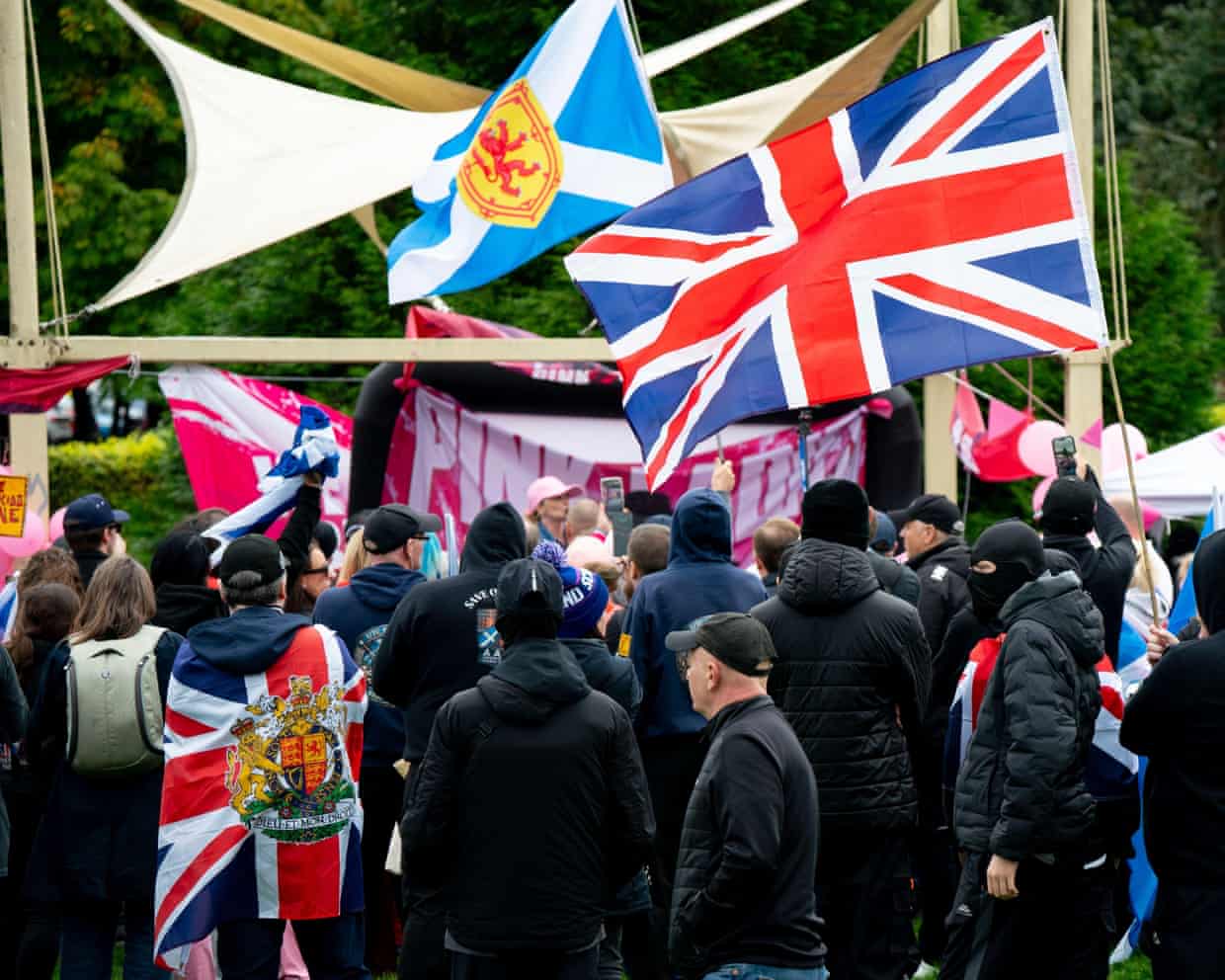 Union and saltire flags flying at the Pink Ladies anti-immigration event in Glasgow.