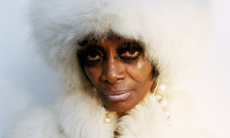 Woman in white fur coat and fur hood