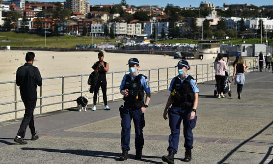 NSW police patrol Bondi Beach promenade July 20 during blockade of Sydney's largest Covid