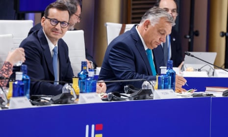 Viktor Orbán (right) and Poland’s prime minister, Mateusz Morawiecki, attend a plenary session in Granada.