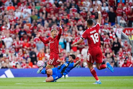 Marcos Senesi does a passable impression of a basketball player to deny Hugo Ekitike a run on goal.