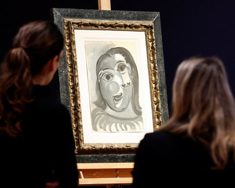 Two people looking at the black and while abstract portrait