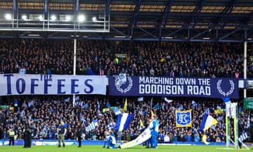 Fans of Everton put up giant banners in the Gwaldys street end during the Premier League match between Everton FC and Liverpool FC at Goodison Park.