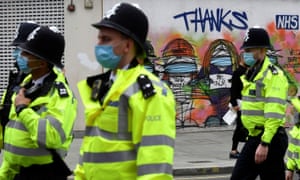 Police officers in masks in London.