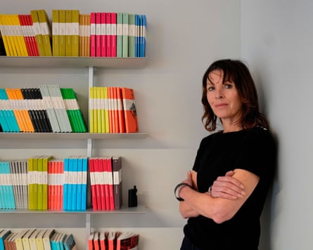 Woman by book shelf