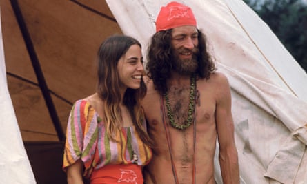 A couple attends the Woodstock music festival in 1969.