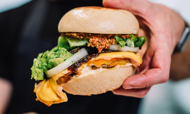 Someone holding a bao bun at New Century, Manchester