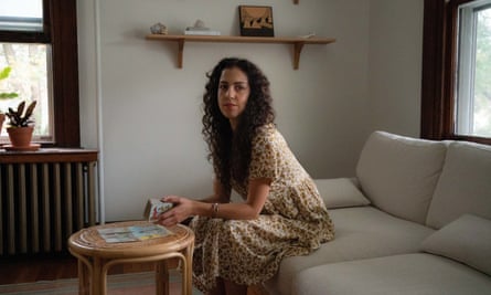Jessica Dore holds tarot cards at her home in Pennsylvania. ‘You’re not predicting the future – you’re really just exploring.’