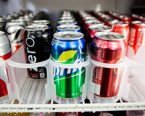 cans of soft drinks in a fridge