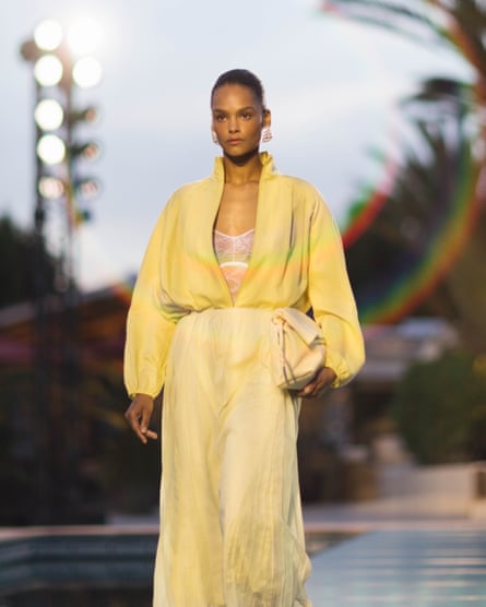 a model wears yellow on the catwalk