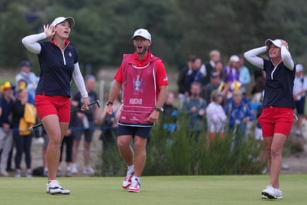 Jennifer Kupcho cups her ear in celebration after an extraordinary putt at the 17th.